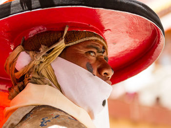 Close-up portrait of man wearing hat