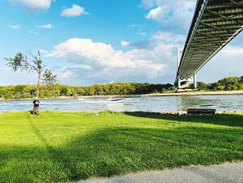 Scenic view of bridge over river against sky
