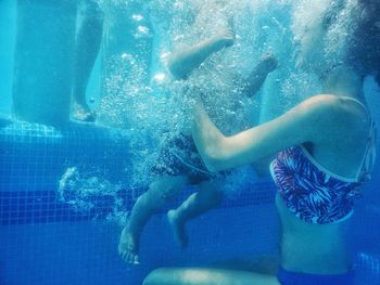 People swimming in swimming pool