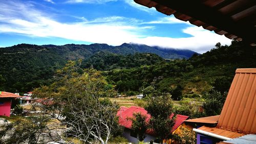 Scenic view of tree mountains against sky