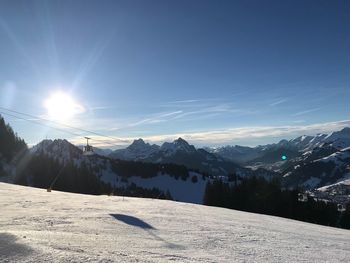 Scenic view of mountains against sky during winter