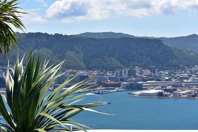 Scenic view of sea and mountains against sky