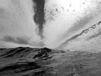 Scenic view of sea against sky and clouds converging on a point on the horizon