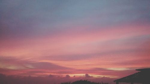 Low angle view of cloudy sky at sunset