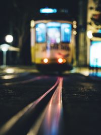 View of illuminated street at night