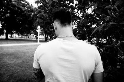 Rear view of man standing in park