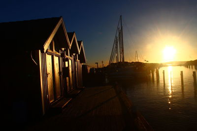 Panoramic view of illuminated buildings against sky during sunset