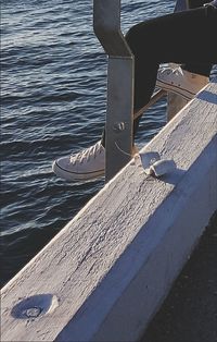 Close-up of wooden post in sea