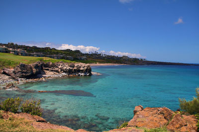 Scenic view of sea against blue sky