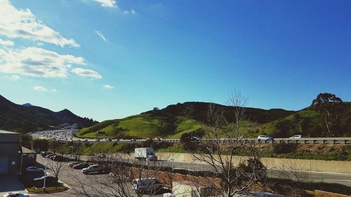 Scenic view of mountains against blue sky