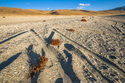 High angle view of shadow on sand