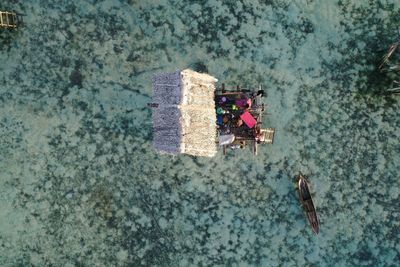 High angle view of people sitting in sea