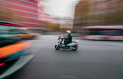 Man riding motorcycle on road