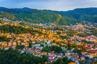 High angle view of townscape and trees against sky