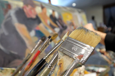 Close-up of paintbrushes in container