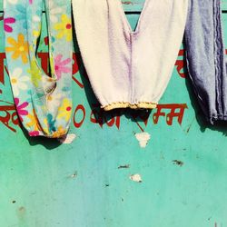 Close-up of clothes hanging on wall