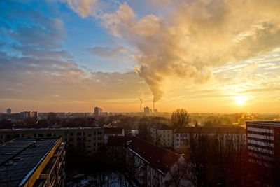 Residential buildings against polluted air at sunset