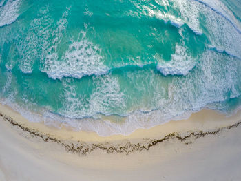 High angle view of surf on beach