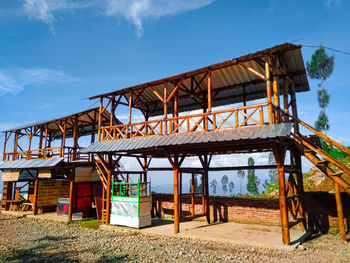 Built structure on beach against sky