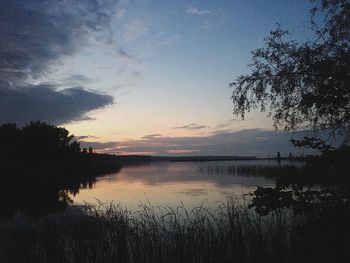 Scenic view of lake against sky during sunset