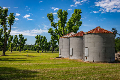 Barn on field against sky