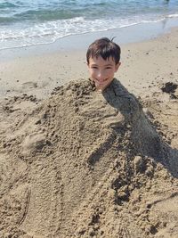 High angle view of woman standing at beach