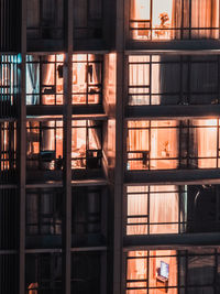 Close up shot of illuminated apartment building at night