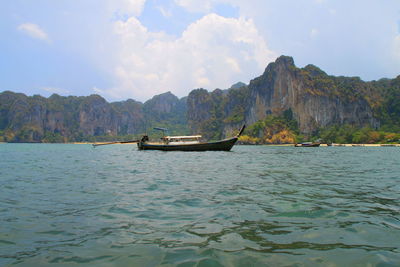 Boat in sea against sky