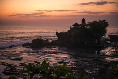 Scenic view of the tanah lot temple during sunset