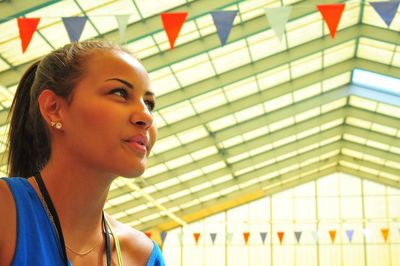 Side view of young woman looking away
