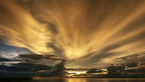 Scenic view of sea against sky at sunset