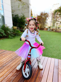 Portrait of cute girl playing with camera