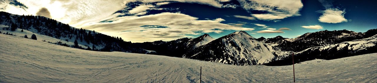 snow, mountain, winter, cold temperature, sky, built structure, architecture, scenics, tranquility, tranquil scene, building exterior, landscape, season, beauty in nature, mountain range, nature, cloud - sky, weather, blue, cloud