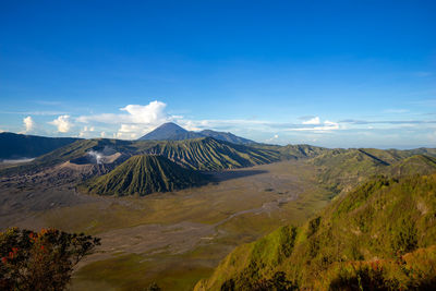 Beautiful view landscape of active volcano crater with smoke at mt. bromo, east java, indonesia.