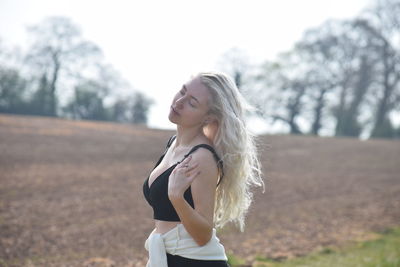 Young woman standing outdoors