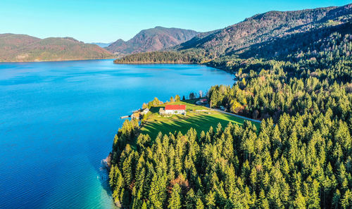 High angle view of lake and mountains against sky