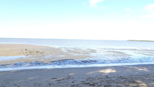 Scenic view of beach against clear sky