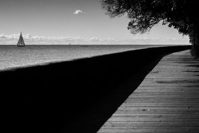 Pier over sea against sky