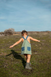 Full length of woman running on field