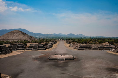 Scenic view of mountains against blue sky