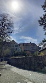 Buildings against cloudy sky