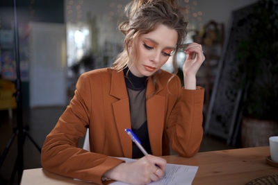 Girl writes on a piece of paper