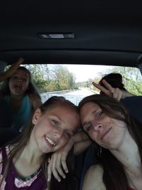 Portrait of smiling family in car