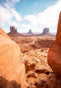 Scenic view of arid landscape against sky