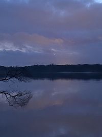 Scenic view of lake against sky at sunset