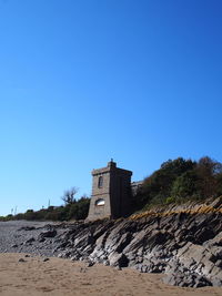 Watch tower  against clear blue sky