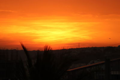 Scenic view of silhouette landscape against romantic sky at sunset