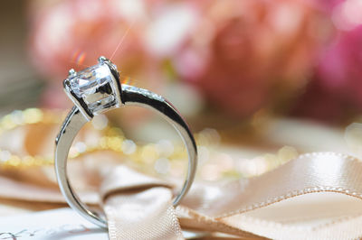 Close-up of wedding rings on table