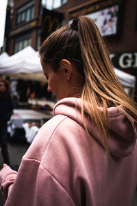 Rear view of woman in street