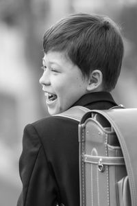 Rear view of boy smiling